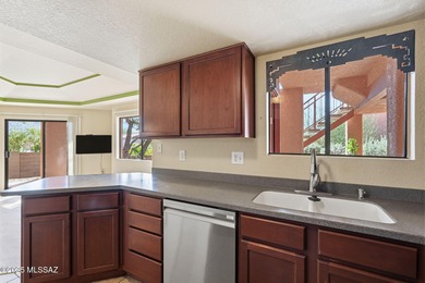 Charming ground floor unit located in a resort style community on The Lodge at Ventana Canyon - Canyon  in Arizona - for sale on GolfHomes.com, golf home, golf lot