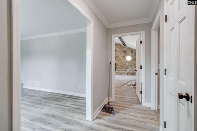 Welcome home to a single-level living space, a custom-built on The Woodlands Country Club in South Carolina - for sale on GolfHomes.com, golf home, golf lot