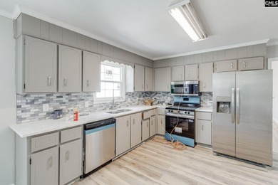 Welcome home to a single-level living space, a custom-built on The Woodlands Country Club in South Carolina - for sale on GolfHomes.com, golf home, golf lot