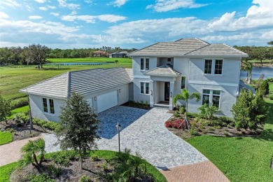 Stunning lake and golf course views are the backdrop for this on The Founders Golf Club in Florida - for sale on GolfHomes.com, golf home, golf lot