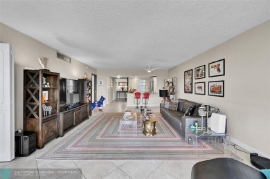This fully remodeled unit features an open kitchen with white on Palm-Aire Country Club and Resort - Palms in Florida - for sale on GolfHomes.com, golf home, golf lot