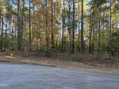 Beautifully wooded building lot, 1acre+. Located on a quite on River Golf and Country Club at Lake Royale in North Carolina - for sale on GolfHomes.com, golf home, golf lot