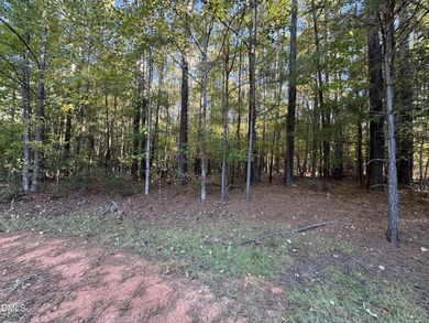 Beautifully wooded building lot, 1acre+. Located on a quite on River Golf and Country Club at Lake Royale in North Carolina - for sale on GolfHomes.com, golf home, golf lot