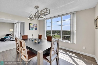 This fully remodeled unit features an open kitchen with white on Palm-Aire Country Club and Resort - Palms in Florida - for sale on GolfHomes.com, golf home, golf lot
