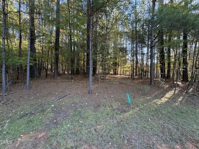 Beautifully wooded building lot, 1acre+. Located on a quite on River Golf and Country Club at Lake Royale in North Carolina - for sale on GolfHomes.com, golf home, golf lot