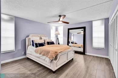 This fully remodeled unit features an open kitchen with white on Palm-Aire Country Club and Resort - Palms in Florida - for sale on GolfHomes.com, golf home, golf lot