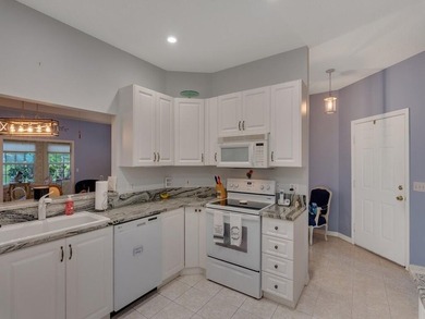 Located on the 5th tee at Gator Trace CC, this beautiful villa on Gator Trace Golf and Country Club in Florida - for sale on GolfHomes.com, golf home, golf lot