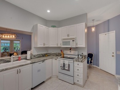 Located on the 5th tee at Gator Trace CC, this beautiful villa on Gator Trace Golf and Country Club in Florida - for sale on GolfHomes.com, golf home, golf lot