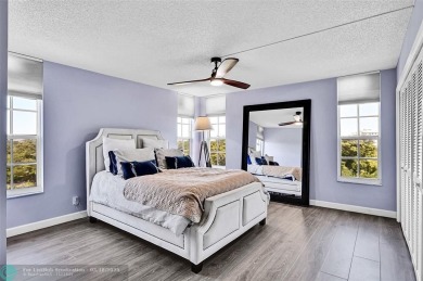This fully remodeled unit features an open kitchen with white on Palm-Aire Country Club and Resort - Palms in Florida - for sale on GolfHomes.com, golf home, golf lot