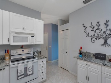 Located on the 5th tee at Gator Trace CC, this beautiful villa on Gator Trace Golf and Country Club in Florida - for sale on GolfHomes.com, golf home, golf lot