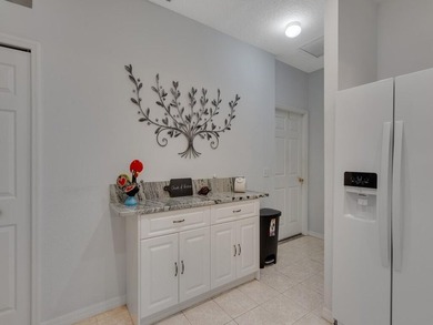 Located on the 5th tee at Gator Trace CC, this beautiful villa on Gator Trace Golf and Country Club in Florida - for sale on GolfHomes.com, golf home, golf lot