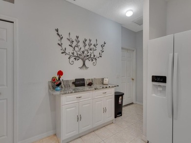 Located on the 5th tee at Gator Trace CC, this beautiful villa on Gator Trace Golf and Country Club in Florida - for sale on GolfHomes.com, golf home, golf lot