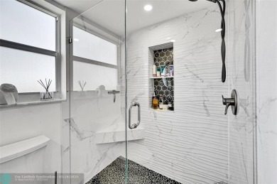 This fully remodeled unit features an open kitchen with white on Palm-Aire Country Club and Resort - Palms in Florida - for sale on GolfHomes.com, golf home, golf lot