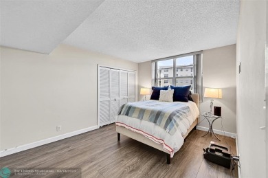 This fully remodeled unit features an open kitchen with white on Palm-Aire Country Club and Resort - Palms in Florida - for sale on GolfHomes.com, golf home, golf lot