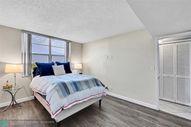 This fully remodeled unit features an open kitchen with white on Palm-Aire Country Club and Resort - Palms in Florida - for sale on GolfHomes.com, golf home, golf lot