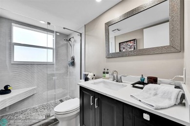 This fully remodeled unit features an open kitchen with white on Palm-Aire Country Club and Resort - Palms in Florida - for sale on GolfHomes.com, golf home, golf lot