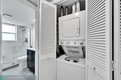 This fully remodeled unit features an open kitchen with white on Palm-Aire Country Club and Resort - Palms in Florida - for sale on GolfHomes.com, golf home, golf lot