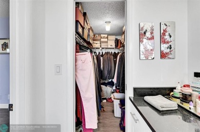This fully remodeled unit features an open kitchen with white on Palm-Aire Country Club and Resort - Palms in Florida - for sale on GolfHomes.com, golf home, golf lot