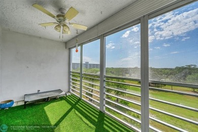 This fully remodeled unit features an open kitchen with white on Palm-Aire Country Club and Resort - Palms in Florida - for sale on GolfHomes.com, golf home, golf lot