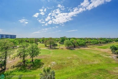 This fully remodeled unit features an open kitchen with white on Palm-Aire Country Club and Resort - Palms in Florida - for sale on GolfHomes.com, golf home, golf lot