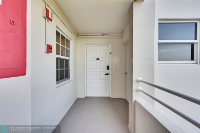 This fully remodeled unit features an open kitchen with white on Palm-Aire Country Club and Resort - Palms in Florida - for sale on GolfHomes.com, golf home, golf lot