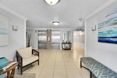 This fully remodeled unit features an open kitchen with white on Palm-Aire Country Club and Resort - Palms in Florida - for sale on GolfHomes.com, golf home, golf lot
