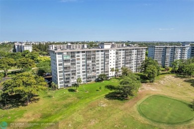 This fully remodeled unit features an open kitchen with white on Palm-Aire Country Club and Resort - Palms in Florida - for sale on GolfHomes.com, golf home, golf lot
