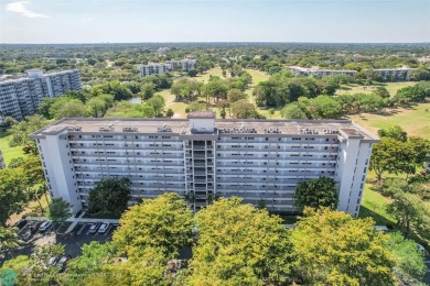 This fully remodeled unit features an open kitchen with white on Palm-Aire Country Club and Resort - Palms in Florida - for sale on GolfHomes.com, golf home, golf lot