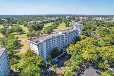 This fully remodeled unit features an open kitchen with white on Palm-Aire Country Club and Resort - Palms in Florida - for sale on GolfHomes.com, golf home, golf lot