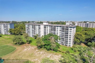 This fully remodeled unit features an open kitchen with white on Palm-Aire Country Club and Resort - Palms in Florida - for sale on GolfHomes.com, golf home, golf lot
