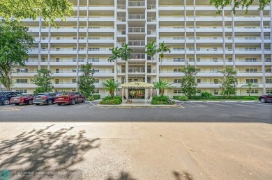 This fully remodeled unit features an open kitchen with white on Palm-Aire Country Club and Resort - Palms in Florida - for sale on GolfHomes.com, golf home, golf lot