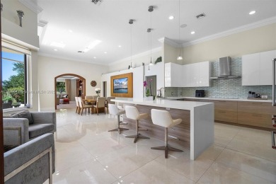 Step into a world of refined luxury and seclusion with on Weston Hills Country Club in Florida - for sale on GolfHomes.com, golf home, golf lot