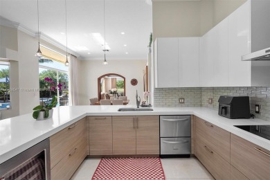 Step into a world of refined luxury and seclusion with on Weston Hills Country Club in Florida - for sale on GolfHomes.com, golf home, golf lot