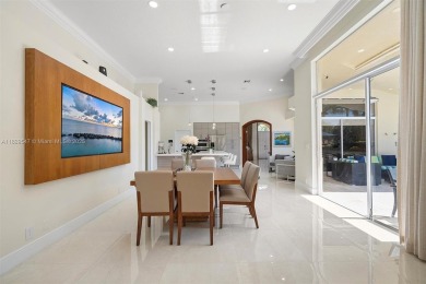 Step into a world of refined luxury and seclusion with on Weston Hills Country Club in Florida - for sale on GolfHomes.com, golf home, golf lot