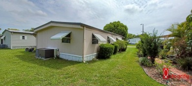 Come settle down and relax in a beautiful manufactured home with on Fairways Country Club in Florida - for sale on GolfHomes.com, golf home, golf lot