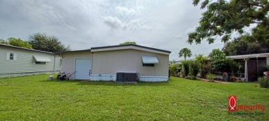 Come settle down and relax in a beautiful manufactured home with on Fairways Country Club in Florida - for sale on GolfHomes.com, golf home, golf lot