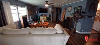 Come settle down and relax in a beautiful manufactured home with on Fairways Country Club in Florida - for sale on GolfHomes.com, golf home, golf lot