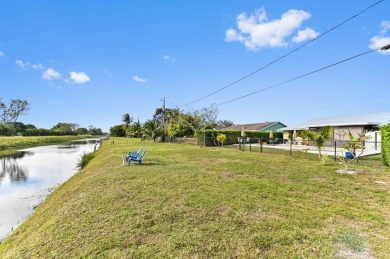 New Metal Roof! New AC! New Impact Windows! Pool! This home has on Atlantis Golf Club in Florida - for sale on GolfHomes.com, golf home, golf lot