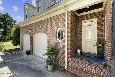 This beautiful brick home in River Landing seamlessly blends on River Landing Golf Course in North Carolina - for sale on GolfHomes.com, golf home, golf lot