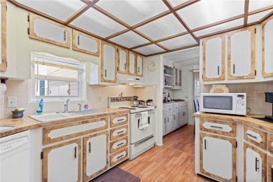 Indulge in breathtaking panoramic golf course views and on Maple Leaf Golf and Country Club in Florida - for sale on GolfHomes.com, golf home, golf lot