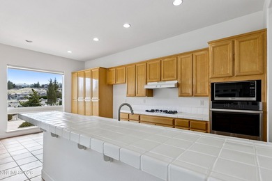 Behind the private gates of ArrowCreek, this thoughtfully on  in Nevada - for sale on GolfHomes.com, golf home, golf lot