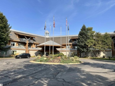 Enjoy a view of the pool from this nicely updated 1 bedroom on Cedar River Golf Course in Michigan - for sale on GolfHomes.com, golf home, golf lot