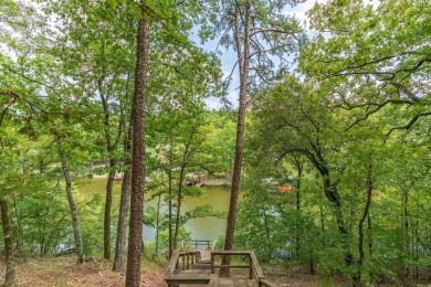 BRAND NEW ROOF on this WATERFRONT Charmer on Lake Pineda! Enjoy on Coronado Golf Course in Arkansas - for sale on GolfHomes.com, golf home, golf lot