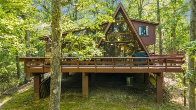 Nestled on a serene 2-acre lot at, this delightful A-frame home on Innsbrook Resort Golf Course in Missouri - for sale on GolfHomes.com, golf home, golf lot