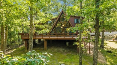 Nestled on a serene 2-acre lot at, this delightful A-frame home on Innsbrook Resort Golf Course in Missouri - for sale on GolfHomes.com, golf home, golf lot