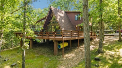 Nestled on a serene 2-acre lot at, this delightful A-frame home on Innsbrook Resort Golf Course in Missouri - for sale on GolfHomes.com, golf home, golf lot