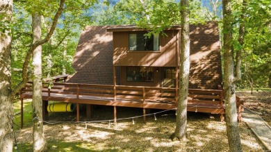 Nestled on a serene 2-acre lot at, this delightful A-frame home on Innsbrook Resort Golf Course in Missouri - for sale on GolfHomes.com, golf home, golf lot