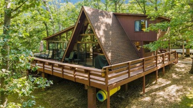 Nestled on a serene 2-acre lot at, this delightful A-frame home on Innsbrook Resort Golf Course in Missouri - for sale on GolfHomes.com, golf home, golf lot