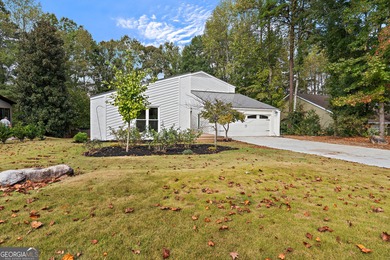 Welcome to this beautifully updated 4-bedroom home perfectly on Canongate At Flat Creek Club in Georgia - for sale on GolfHomes.com, golf home, golf lot