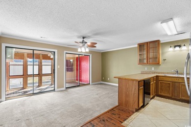 This first-floor 1-bedroom, 1.5 bath condo in Fairwood Lakes at on Heron Point Golf Club in South Carolina - for sale on GolfHomes.com, golf home, golf lot